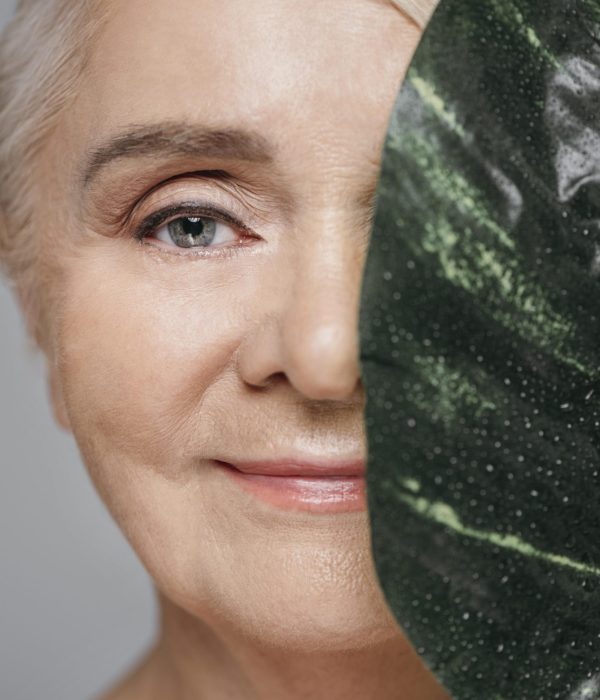 close-up-woman-holding-leaf